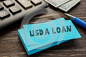 Financial concept about USDA LOAN United States Department of Agriculture with sign on the page