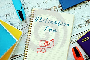 Financial concept about Utilization Fee with sign on the sheet
