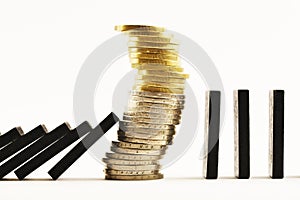 Financial crisis concept with pile of cash money under domino effect, white background