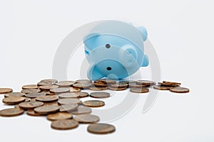 Financial crisis symbol. Economic impact global recession. Dead Piggy bank and coins on white background