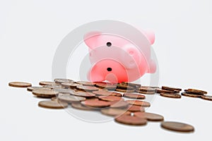 Financial crisis symbol. Economic impact global recession. Dead Piggy bank and coins on white background