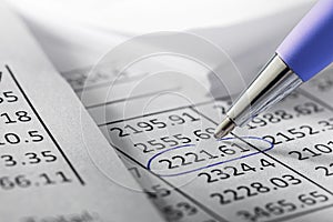 Financial data analyzing and report chart data, pen marking financial data