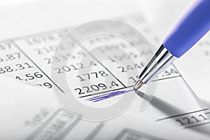 Financial data analyzing and report chart data, pen marking financial data