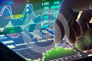 Financial data on a monitor,candle stick graph of stock market ,