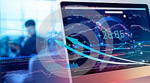 Financial data on a monitor. Investing and stock market gain and profits with graph charts, diagrams, growth, financial figures. photo