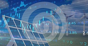 Financial data processing against solar panel and windmill in background