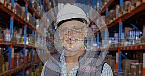 Financial data processing over portrait of caucasian senior male supervisor smiling at warehouse