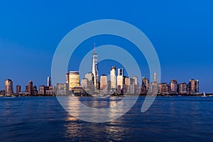 Financial District skyscrapers and Hudson River at dusk. Lower Manhattan, New York City