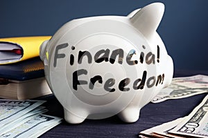 Financial freedom written on a side of piggy bank.