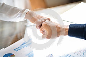 Financial Graph And Diagram. Analyst Fist Bump