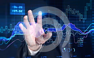 Financial graph showing increase of price in stock market, internet trading concept, business person touching chart by finger.