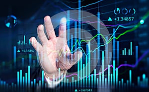 Financial graph showing increase of price in stock market, internet trading concept, business person touching chart by finger.