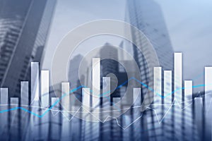 Financial graphs and charts on blurred business center background. Invesment and trading concept.Ñ