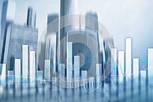 Financial graphs and charts on blurred business center background. Invesment and trading concept