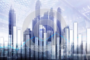 Financial graphs and charts on blurred business center background. Invesment and trading concept