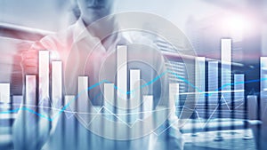 Financial graphs and charts on blurred business center background. Invesment and trading concept.