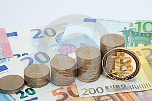 Financial growth concept. Histogram with coins and Bitcoin in euro background. Photo new virtual money