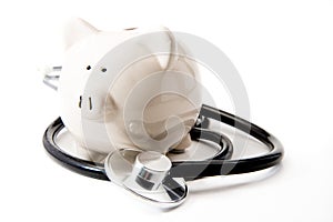 Financial Health - Black Stethoscope & Piggy Bank