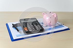 Financial insurance piggy bank with calculator Retirement Plan and Pension