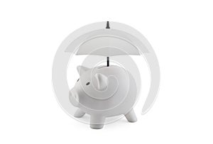 Financial insurance. White piggy bank with umbrella isolated on white