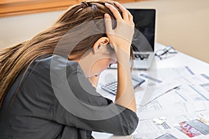 Financial owe asian woman sitting cover head with hands, stressed by calculate expense from invoice or bill, have no money to pay
