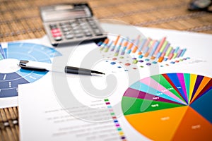 Financial paper charts and graphs on the table.business