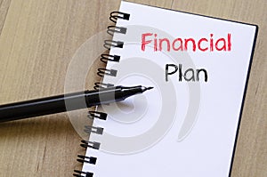 Financial plan text concept on notebook