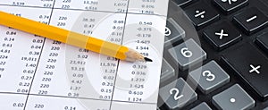 Financial planning with calculator and pencil on data