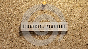 financial planning written on wooden surface. Wooden concept. Work and education, personal development