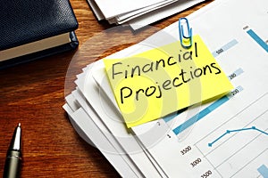 Financial Projections label on a pile of business documents photo