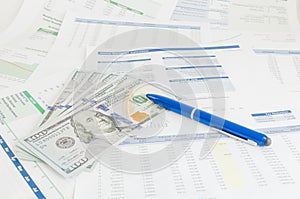 Financial report with money and pen business concept