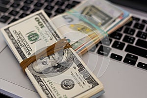 Financial risk, debt default concept : US USD dollar, laptop, silver handcuff.