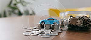 Financial statement with coins Saving money for car