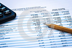 Financial statement and eyeglass, business concept, document is mock-up