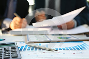 Financial statistics documents ball pen