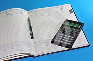 Financial tools, agenda, pen and calculator