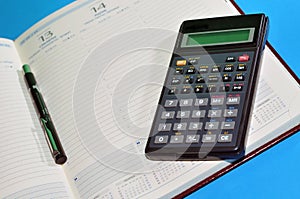 Financial tools, agenda, pen and calculator