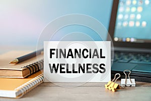 Financial Wellness - an inscription on a card near office supplies