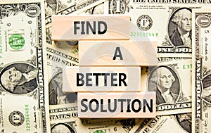 Find a better solution symbol. Concept words Find a better solution on wooden blocks. Beautiful background from dollar bills.