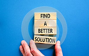 Find a better solution symbol. Concept words Find a better solution on wooden blocks. Beautiful blue table blue background.