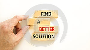 Find a better solution symbol. Concept words Find a better solution on wooden blocks. Beautiful white table white background.