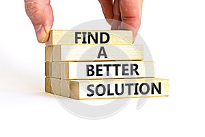 Find a better solution symbol. Concept words Find a better solution on wooden blocks. Beautiful white table white background.