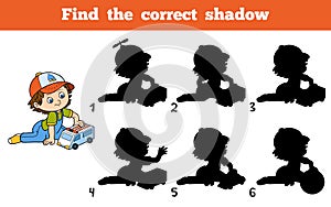 Find the correct shadow. Little boy plays with ambulance car