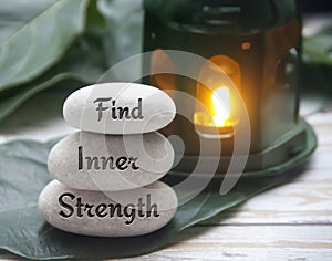 Find inner strength words engraved on zen stones. Motivational concept