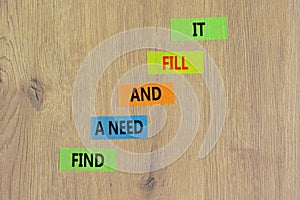Find a need and fill it symbol. Concept words Find a need and fill it on color papers on a beautiful wooden background. Business