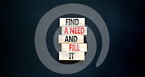 Find a need and fill it symbol. Concept words Find a need and fill it on wooden blocks on a beautiful black table black background