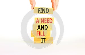 Find a need and fill it symbol. Concept words Find a need and fill it on wooden blocks on a beautiful white background.