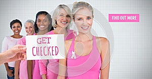 Find out more button with Get checked Text and Hand holding card with pink breast cancer awareness w