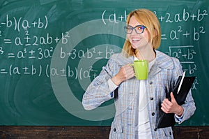 Find time to relax and stay positive. Keep positive attitude to work. Woman with tea cup and document folder chalkboard