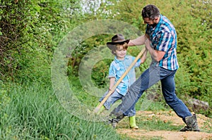 Find treasures. Little boy and father with shovel looking for treasures. Spirit of adventures. Adventure hunting for